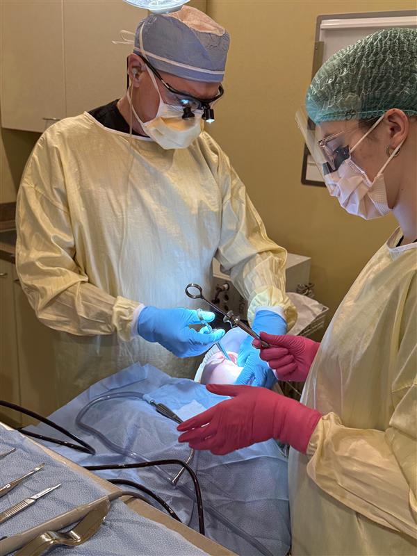 Dr. Patrick A. Scioscia during dental surgery